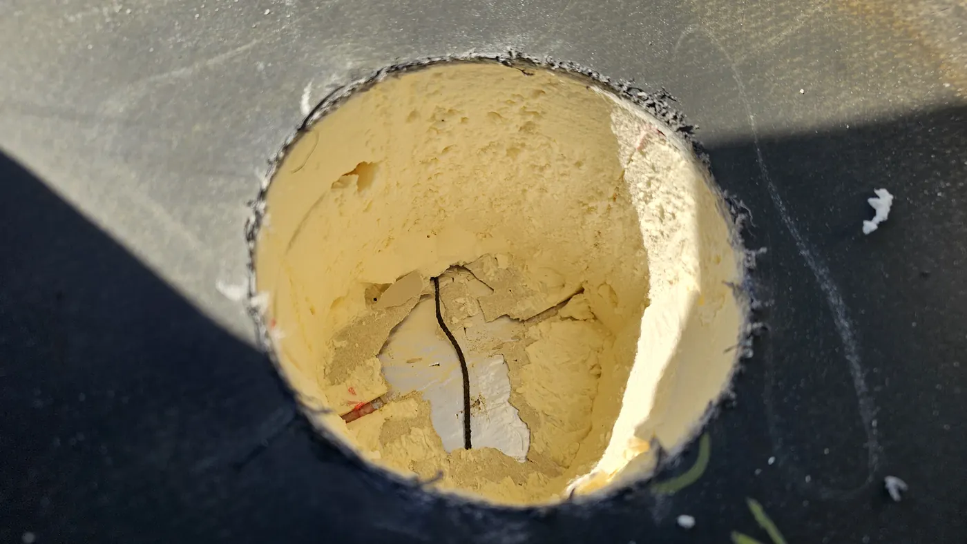 Sensor cylinder cored into roof insulation